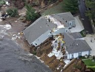 house collapses into the sand